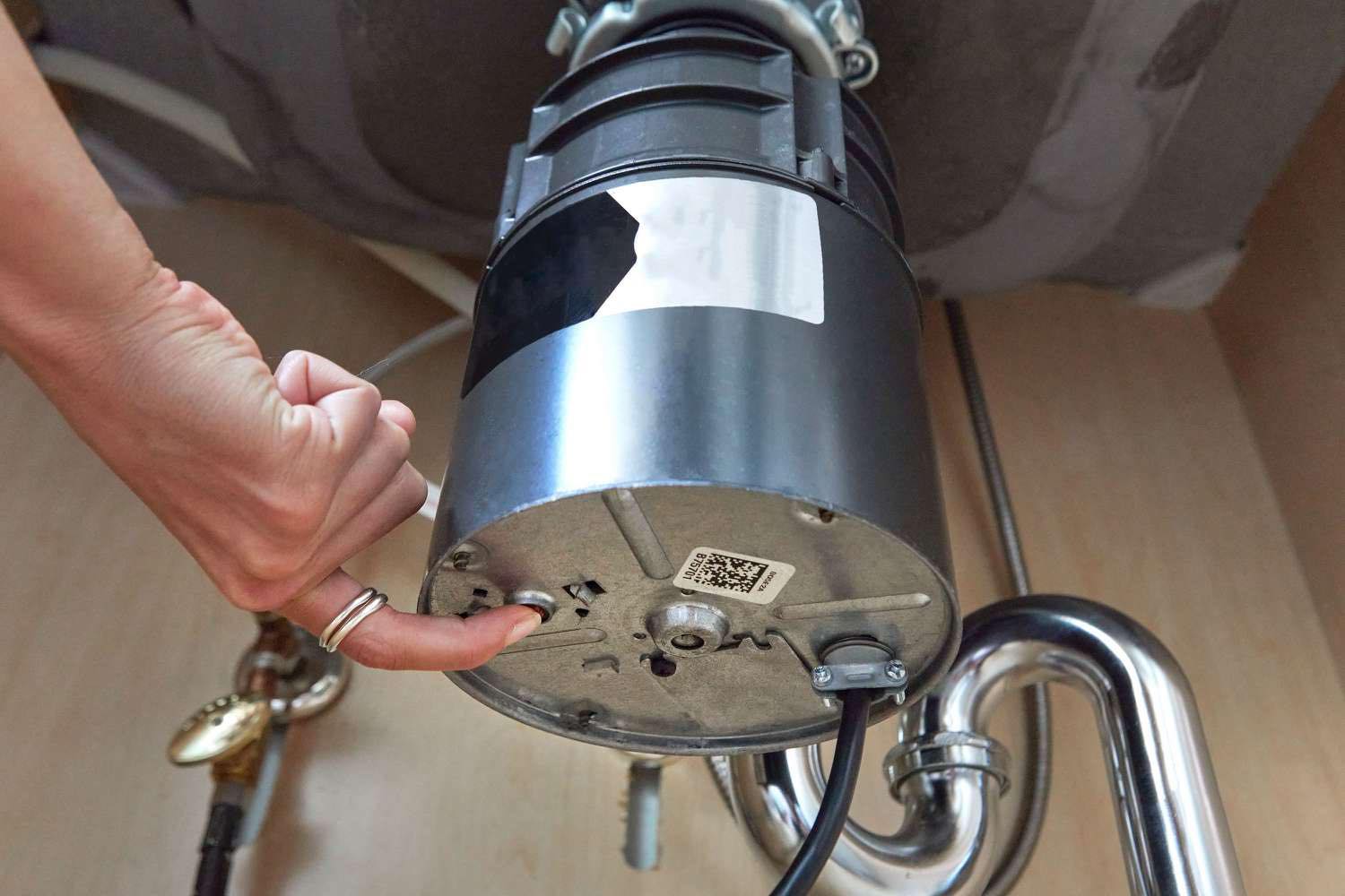 Why does your garbage disposal keep tripping the reset button?